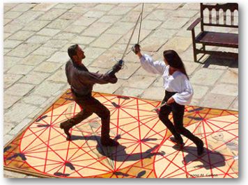 Tessa and Maestro Torres training in the salle.